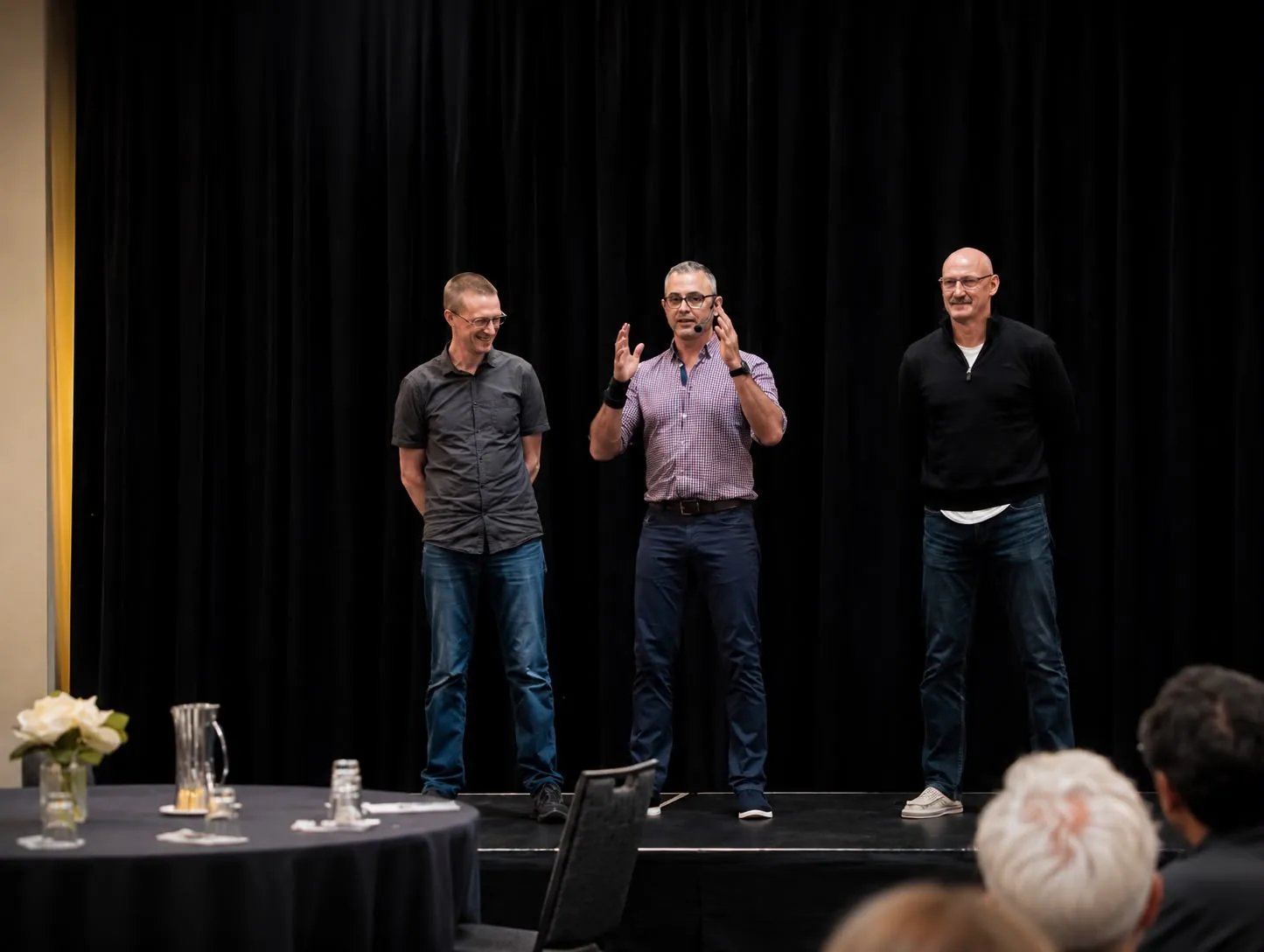 Live body-language demonstration with volunteers on stage at a corporate conference